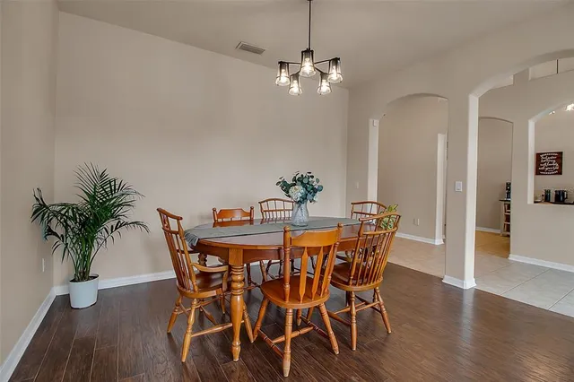 a dining room with furniture a livingroom and chandelier
