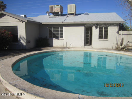 1221 East Ocotillo Road Phoenix, AZ 85014 - Photo 23 of 24 a view of a house with a backyard