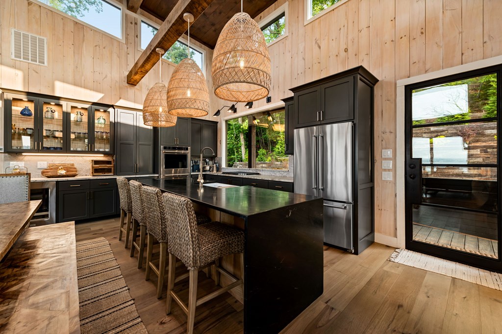 61 Ripshin Heights Blue Ridge, GA 30513 - Photo 14 of 28 a kitchen with stainless steel appliances kitchen island granite countertop a refrigerator a stove and a sink with wooden floor
