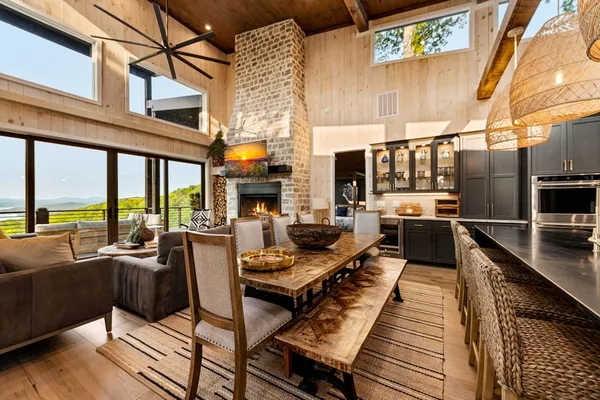 a view of a living room with furniture and a kitchen