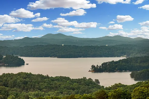 a view of lake with green space