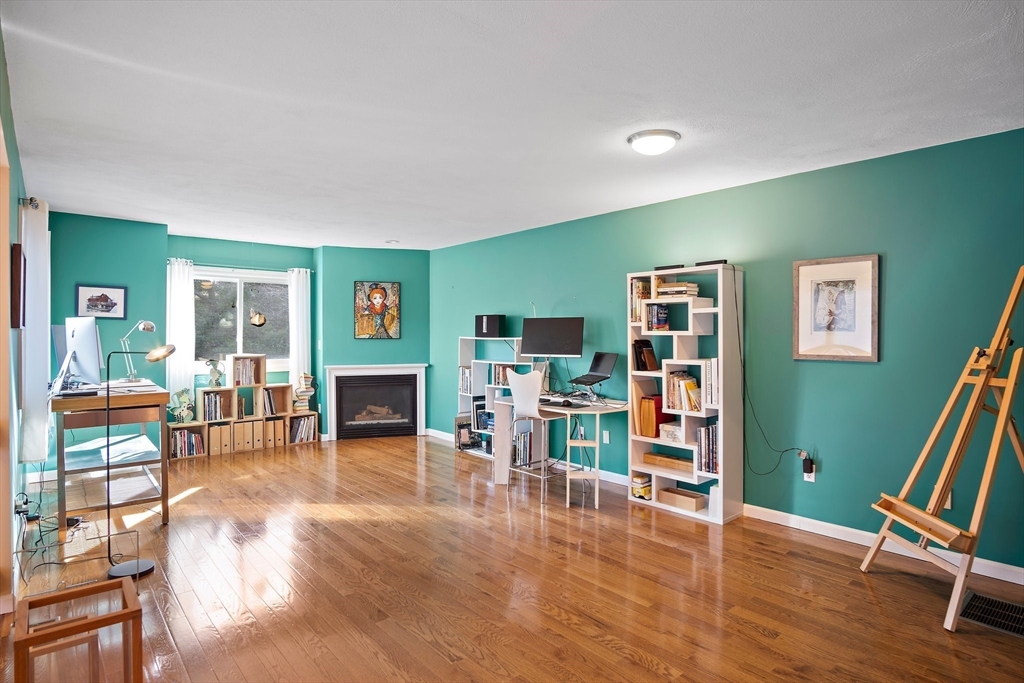3 Mariners Way, Unit 3 Salem, MA 01970 - Photo 11 of 37 a living room with furniture and a fireplace