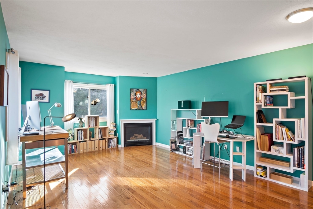3 Mariners Way, Unit 3 Salem, MA 01970 - Photo 12 of 37 a living room with furniture and a fireplace