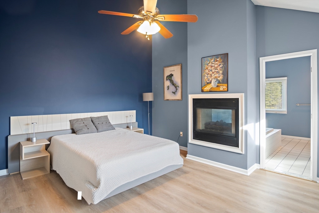 3 Mariners Way, Unit 3 Salem, MA 01970 - Photo 18 of 37 a bedroom with a bed and a fireplace