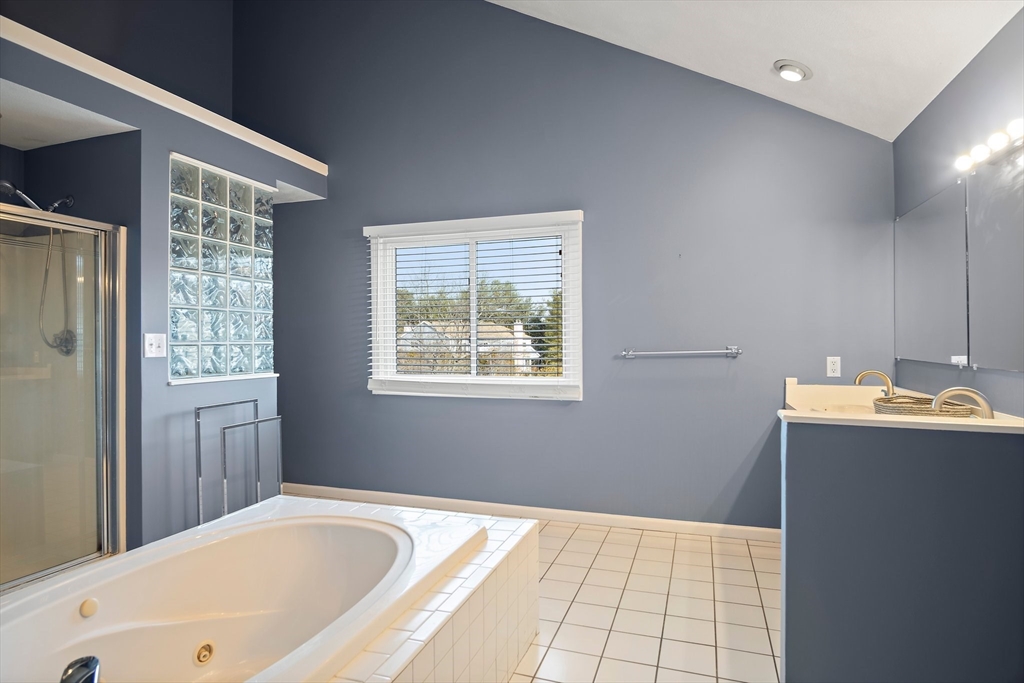 3 Mariners Way, Unit 3 Salem, MA 01970 - Photo 22 of 37 a bathroom with a tub sink and mirror