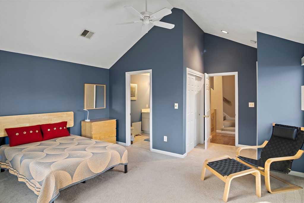 3 Mariners Way, Unit 3 Salem, MA 01970 - Photo 23 of 37 a bedroom with a bed and a chair