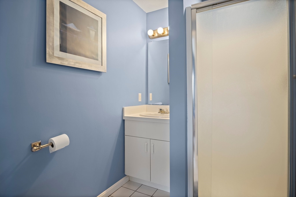 3 Mariners Way, Unit 3 Salem, MA 01970 - Photo 25 of 37 a bathroom with a sink a mirror and vanity