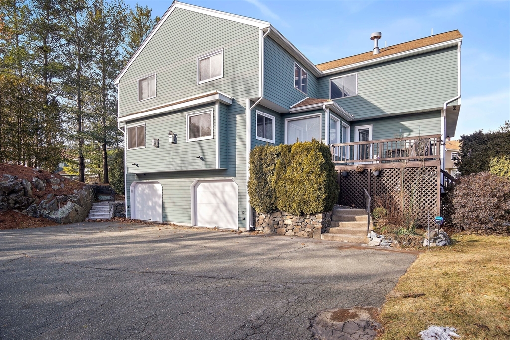 3 Mariners Way, Unit 3 Salem, MA 01970 - Photo 29 of 37 a front view of a house with garden