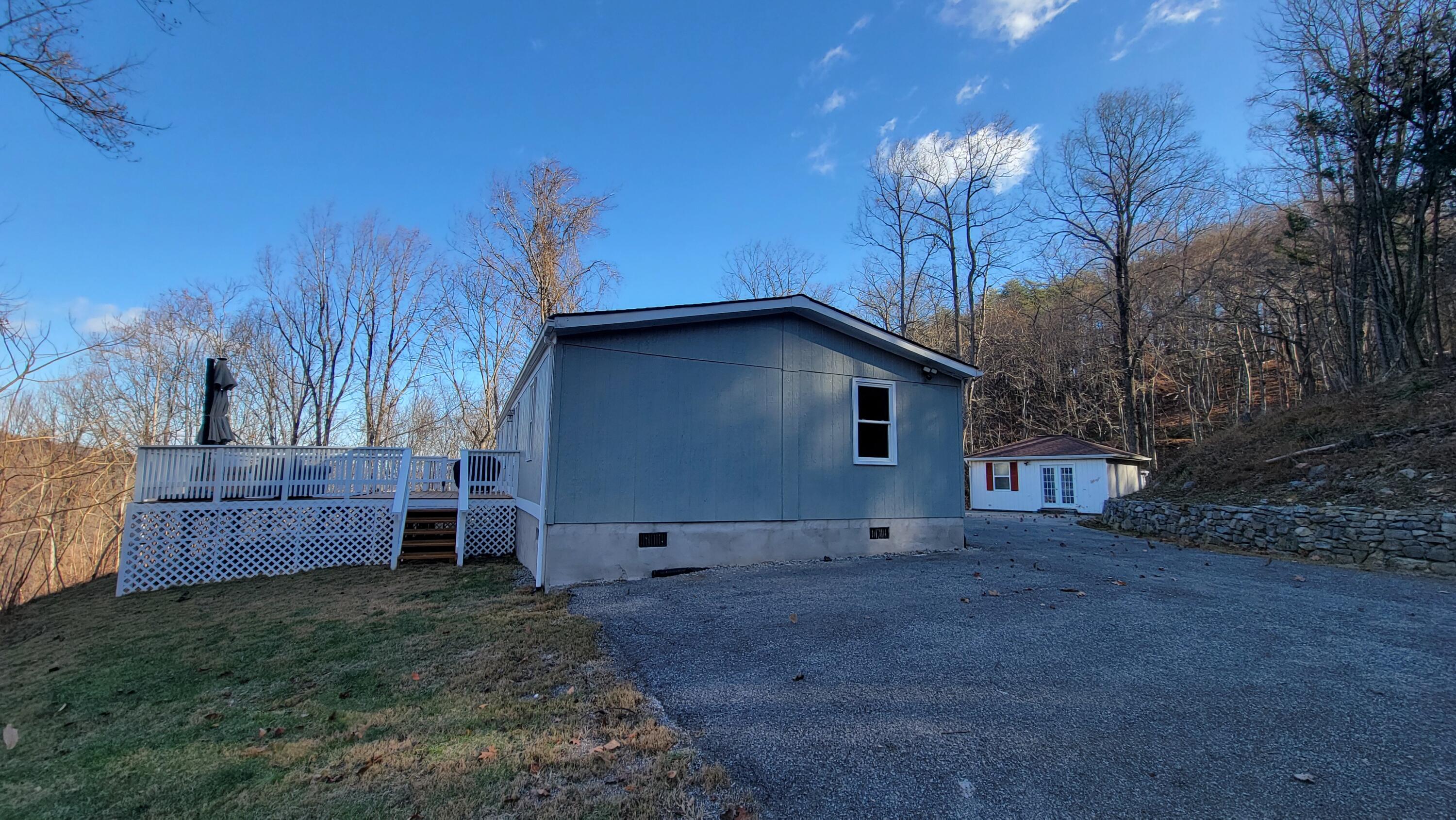 4350 Mountain View Church Road Blue Ridge, VA 24064 - Photo 21 of 30 a view of backyard with potted plants and wooden fence