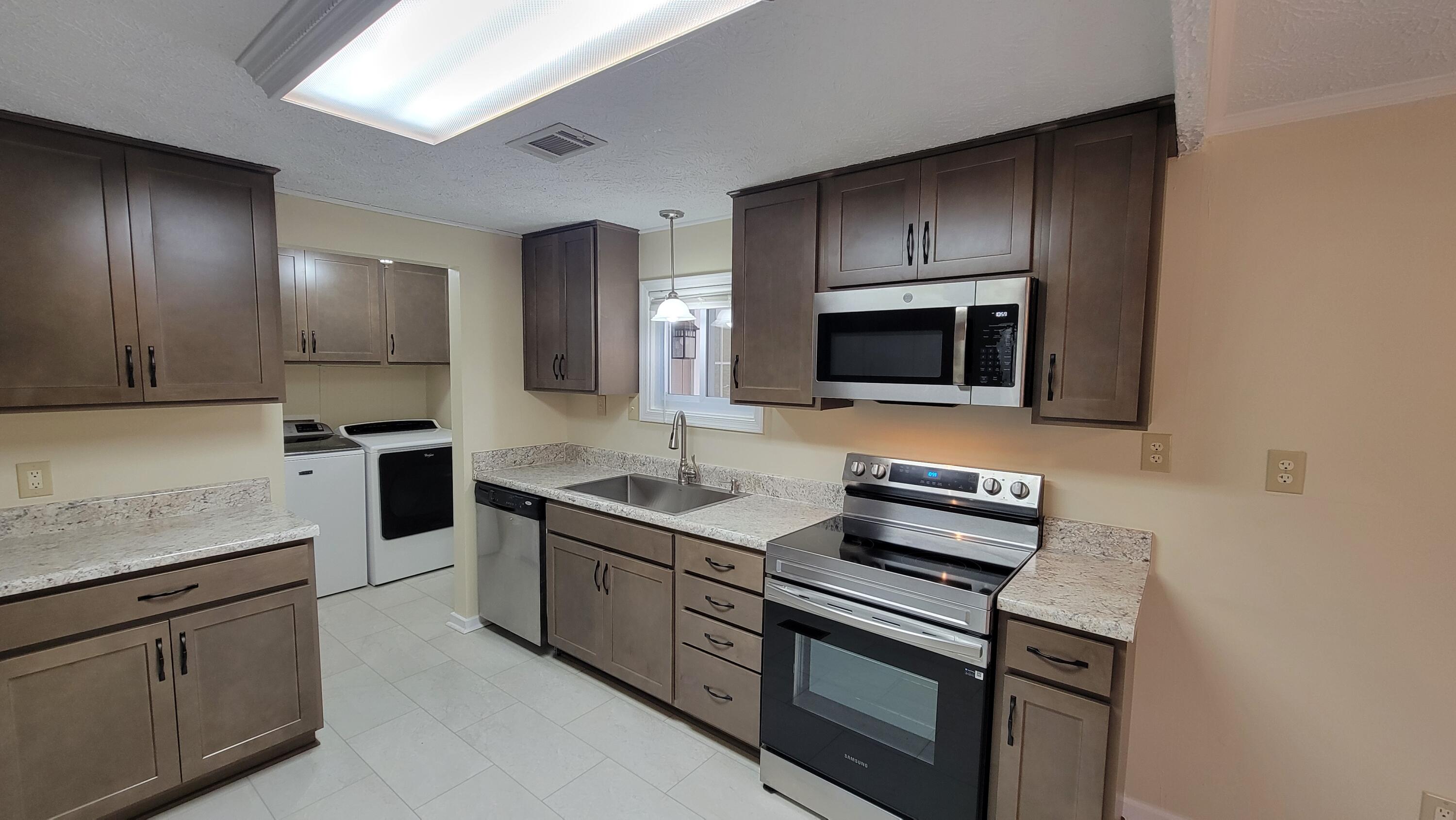 4350 Mountain View Church Road Blue Ridge, VA 24064 - Photo 3 of 30 a kitchen with a sink and steel appliances