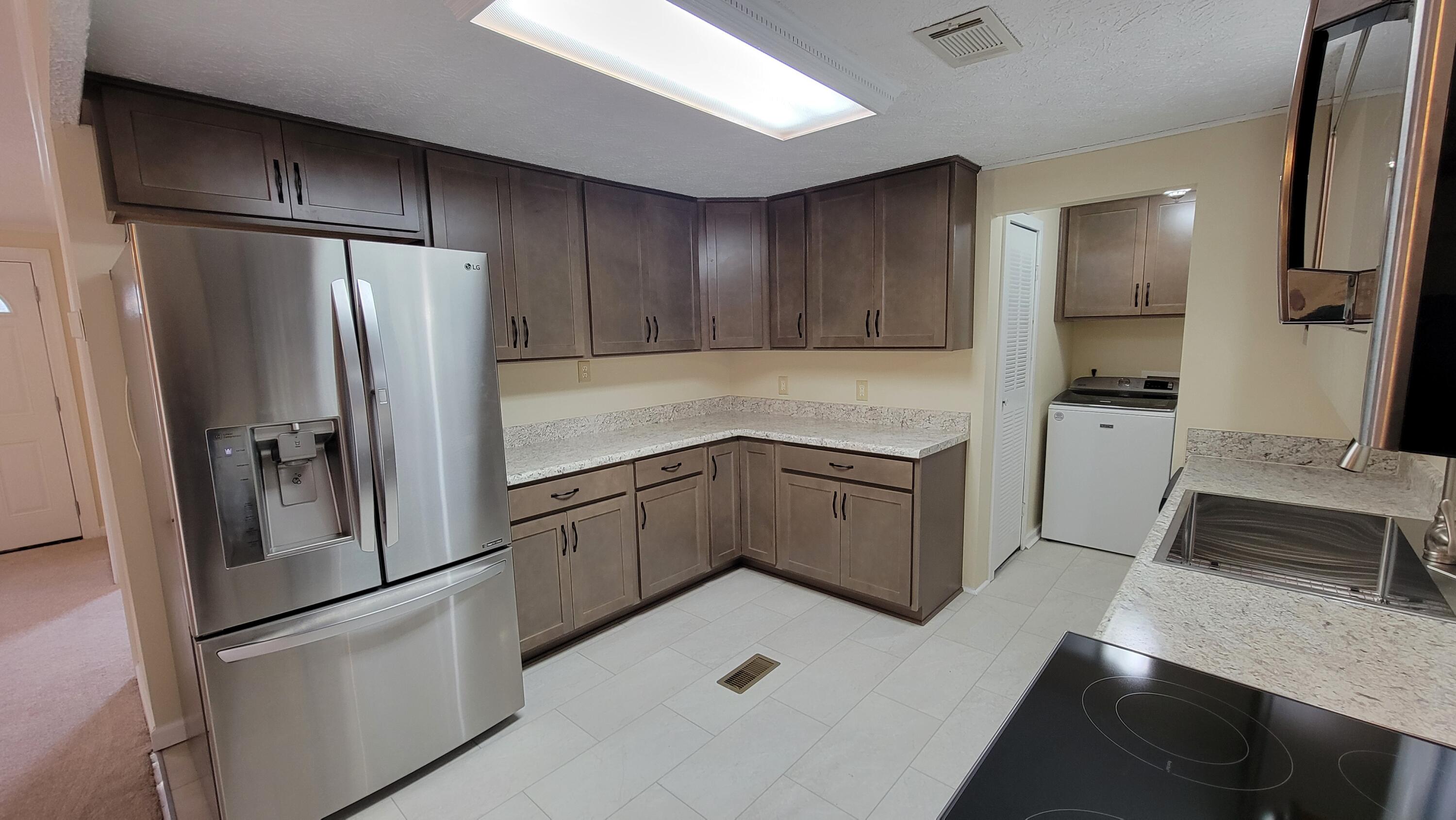 4350 Mountain View Church Road Blue Ridge, VA 24064 - Photo 4 of 30 a kitchen with a refrigerator sink and cabinets