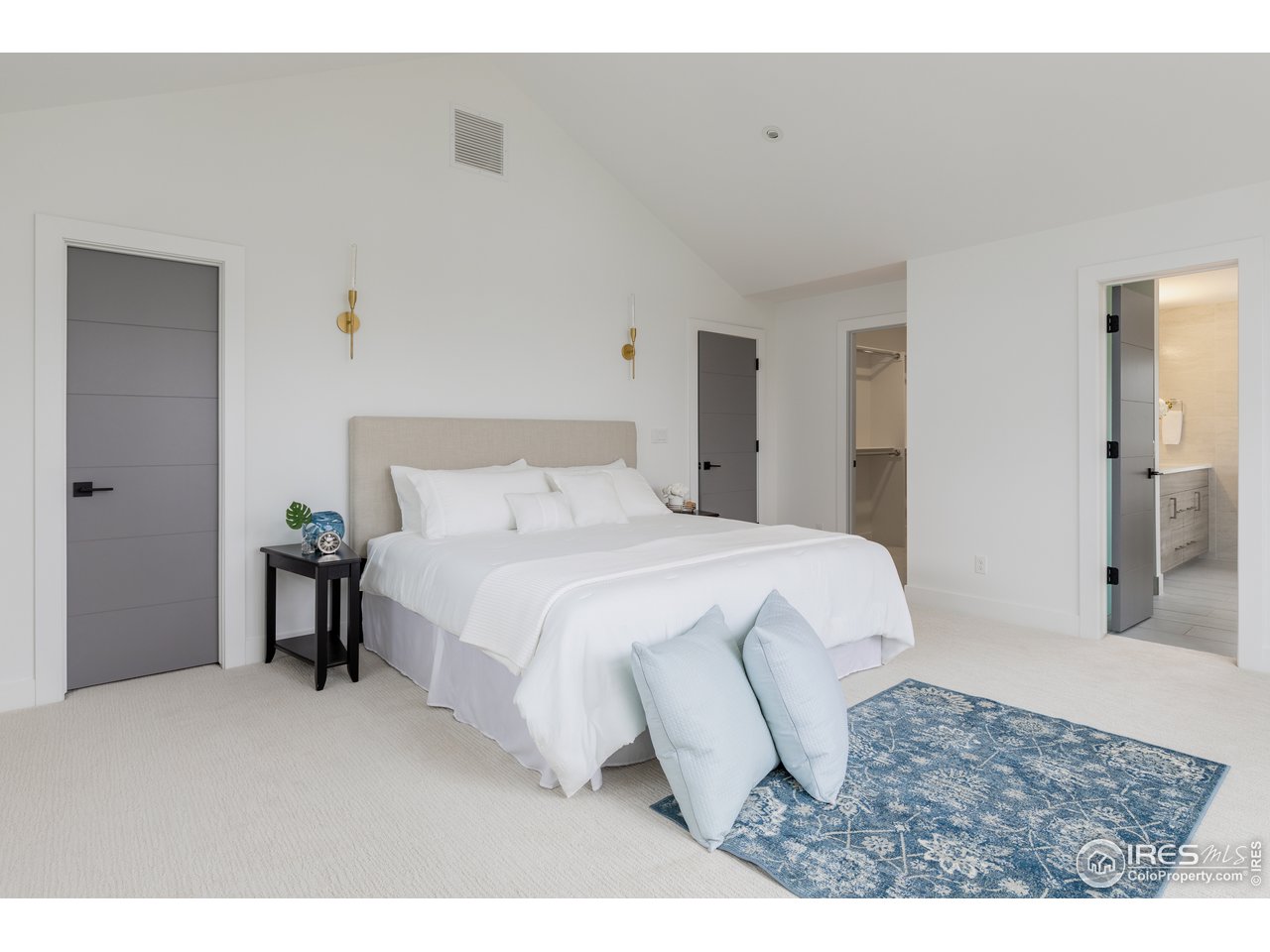 3025 18th Street Boulder, CO 80304 - Photo 17 of 35 a bedroom with a bed and a dresser