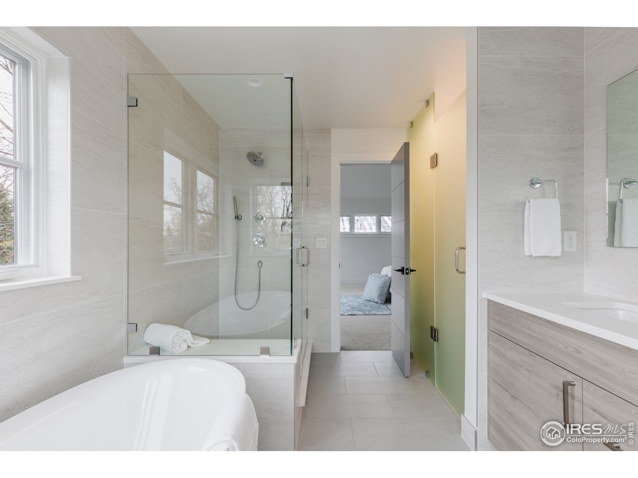 3025 18th Street Boulder, CO 80304 - Photo 23 of 35 a bathroom with a tub sink shower and a mirror