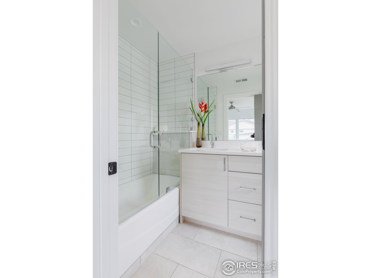 3025 18th Street Boulder, CO 80304 - Photo 26 of 35 a bathroom with a bathtub sink and mirror