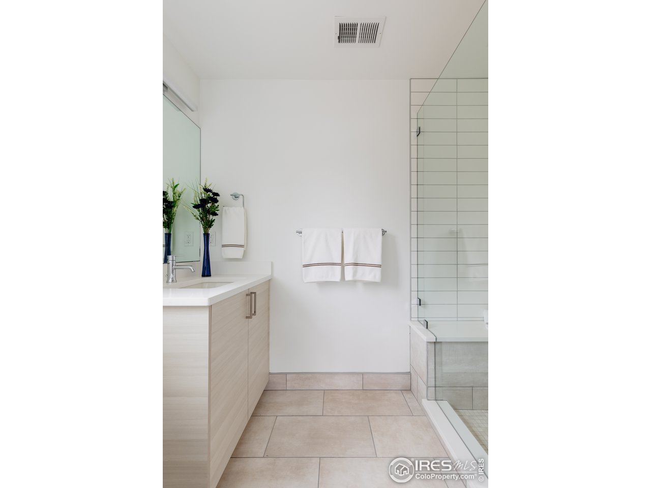 3025 18th Street Boulder, CO 80304 - Photo 31 of 35 a bathroom with a sink and a mirror