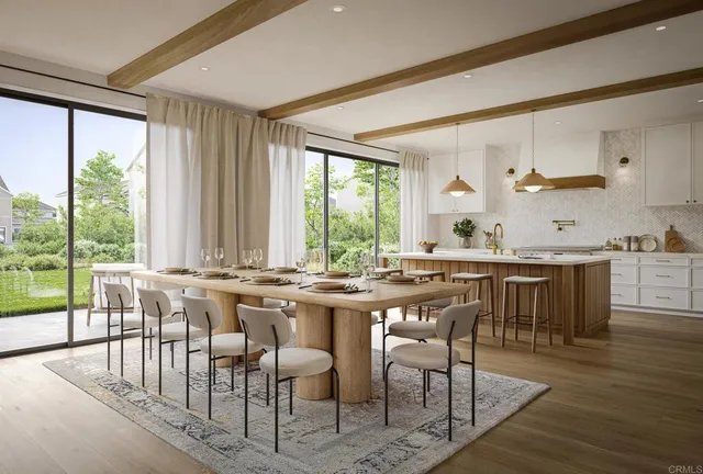 a view of a dining room with furniture and window