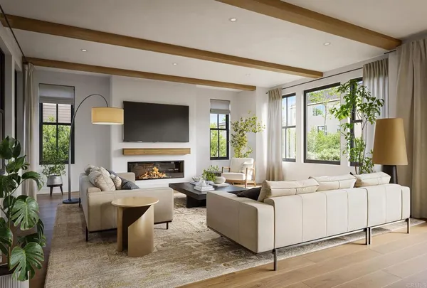 a living room with fireplace furniture and a large window