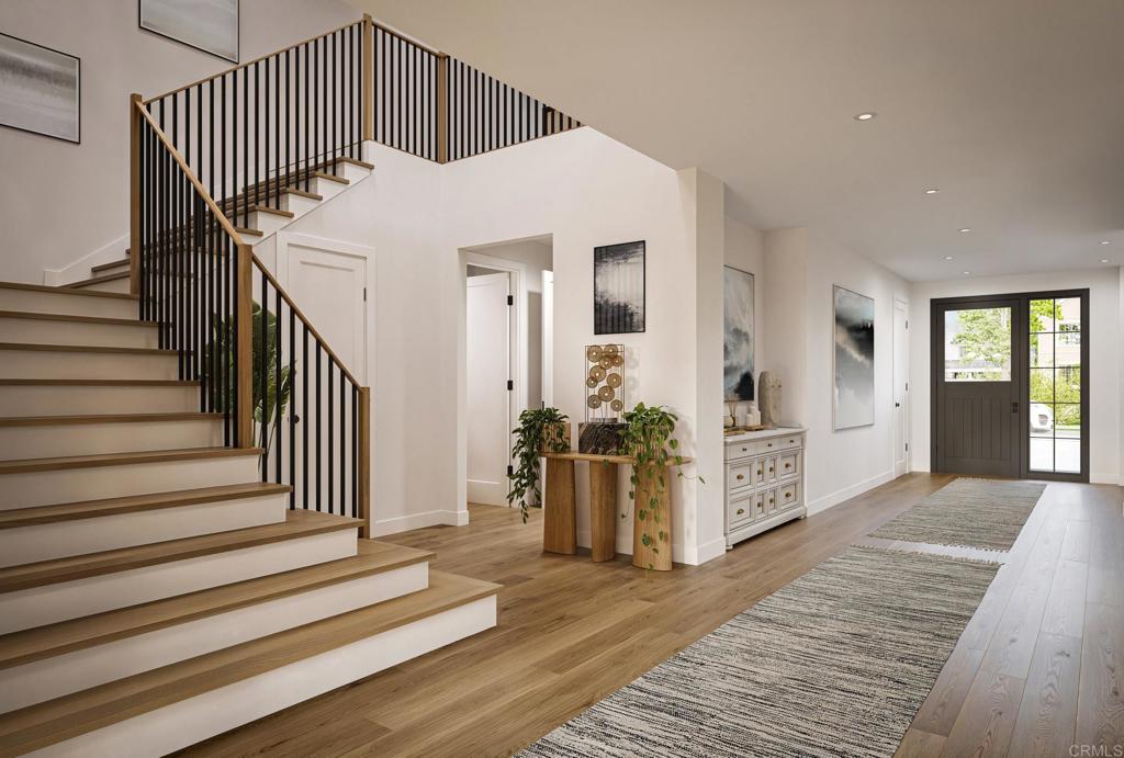 772 Conestoga Court Encinitas, CA 92024 - Photo 4 of 7 a view of a hallway with stairs and wooden floor