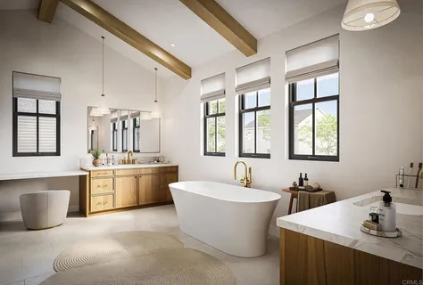 a large white kitchen with a large window