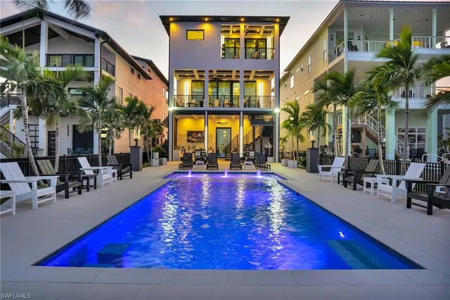 a view of swimming pool with outdoor seating