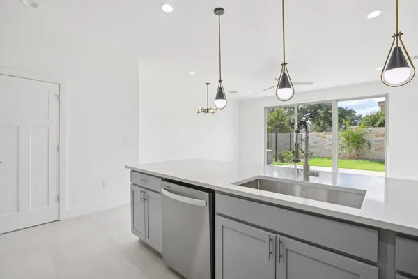 a kitchen with a sink and a window