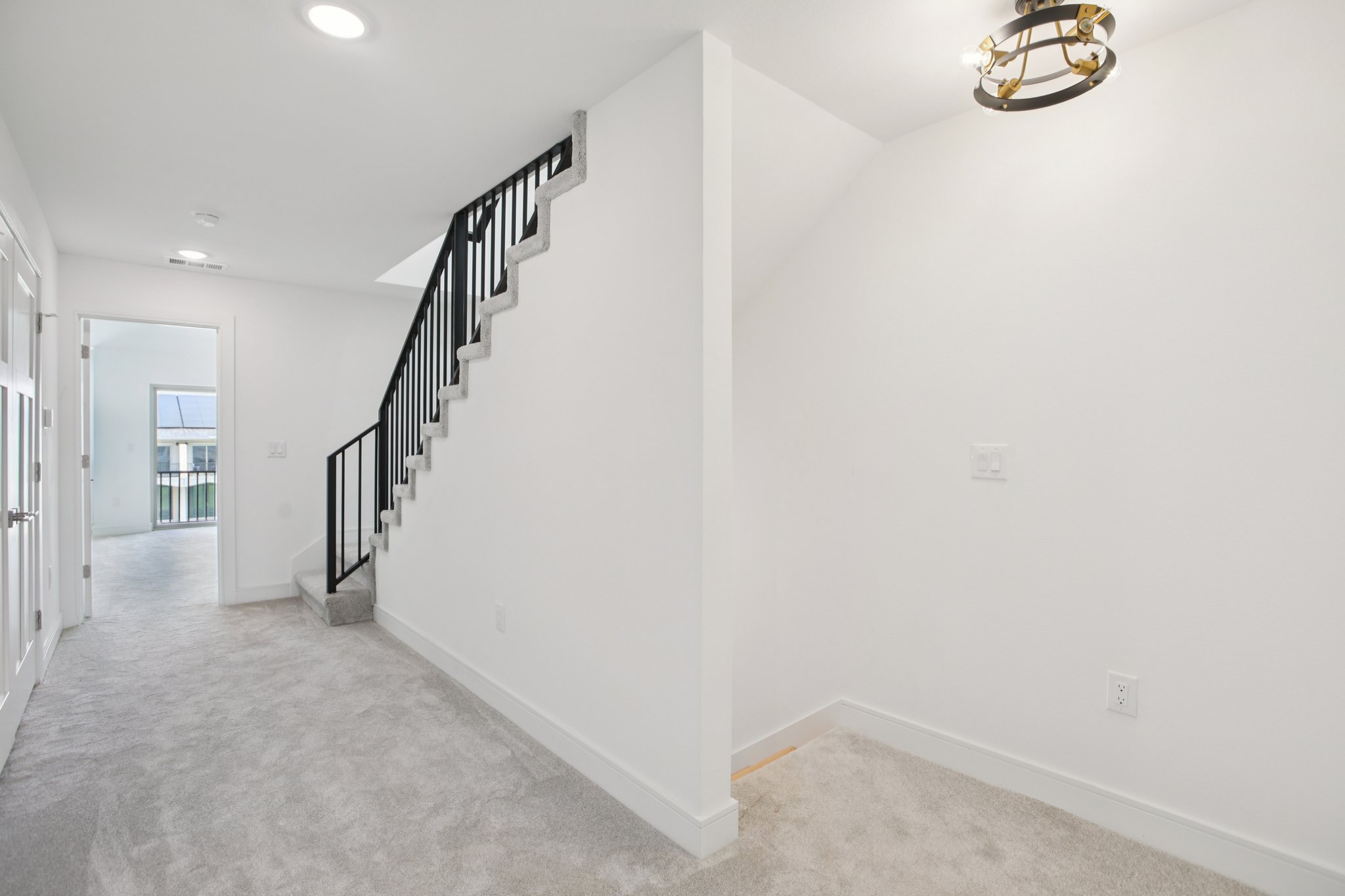 302 Tesla Circle Austin, TX 78681 - Photo 19 of 40 a view of a hallway with staircase