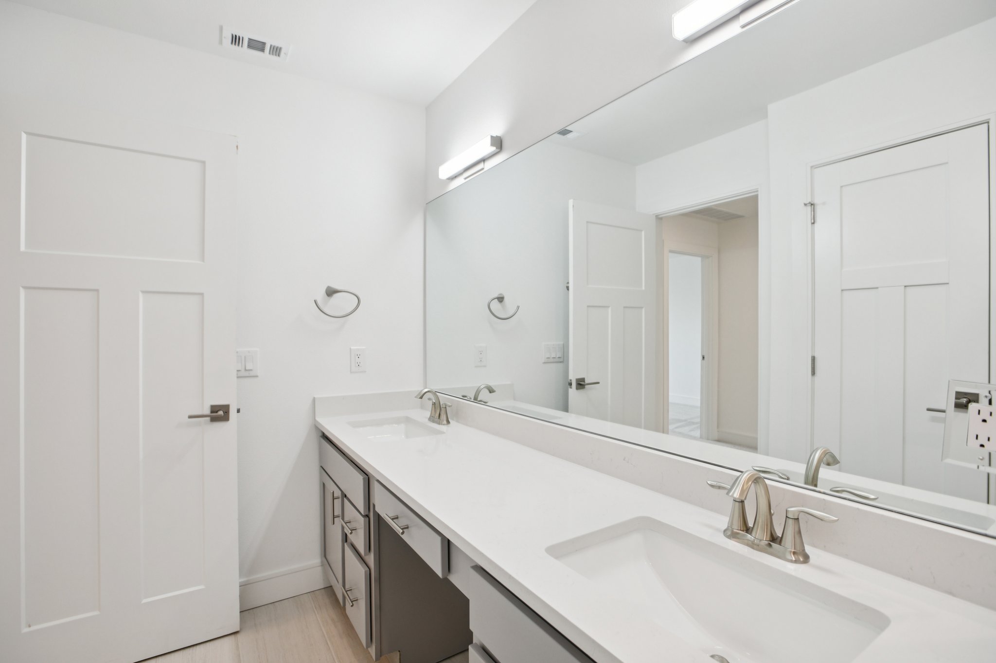 302 Tesla Circle Austin, TX 78681 - Photo 25 of 40 a bathroom with a sink and a mirror