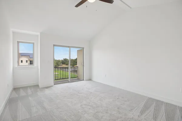 an empty room with a empty space and windows