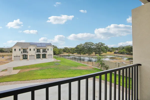 a view of building with swimming pool and outdoor space