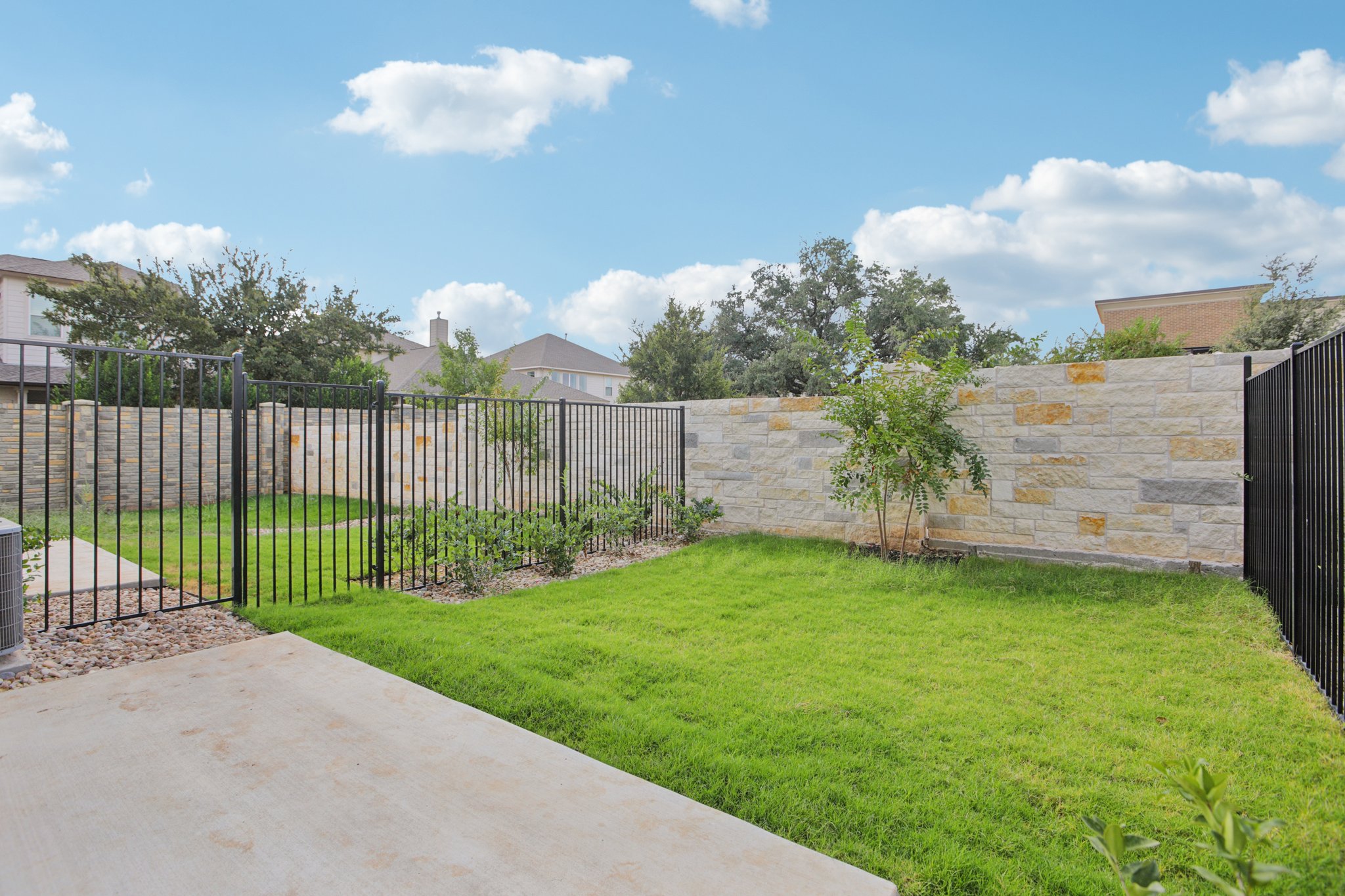 302 Tesla Circle Austin, TX 78681 - Photo 39 of 40 a view of a backyard with a garden