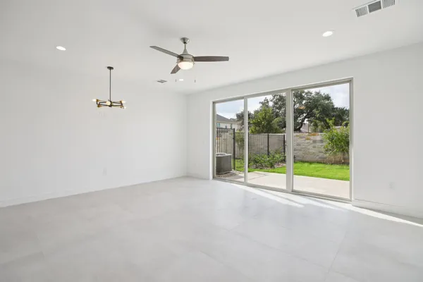 a view of an empty room with windows