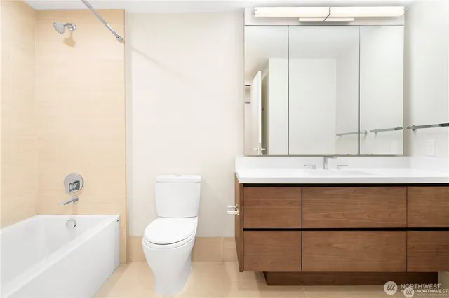 a bathroom with a toilet a sink and a bathtub