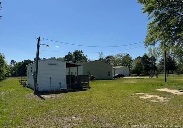a backyard of a house with lots of green space