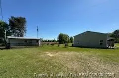 a view of a house with a big yard