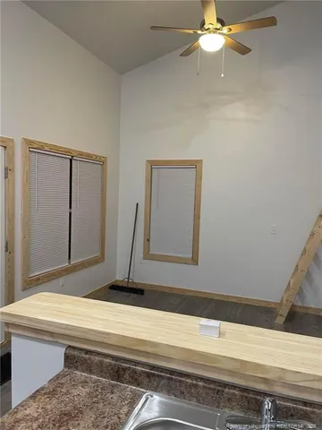 a kitchen with granite countertop a stove and a sink