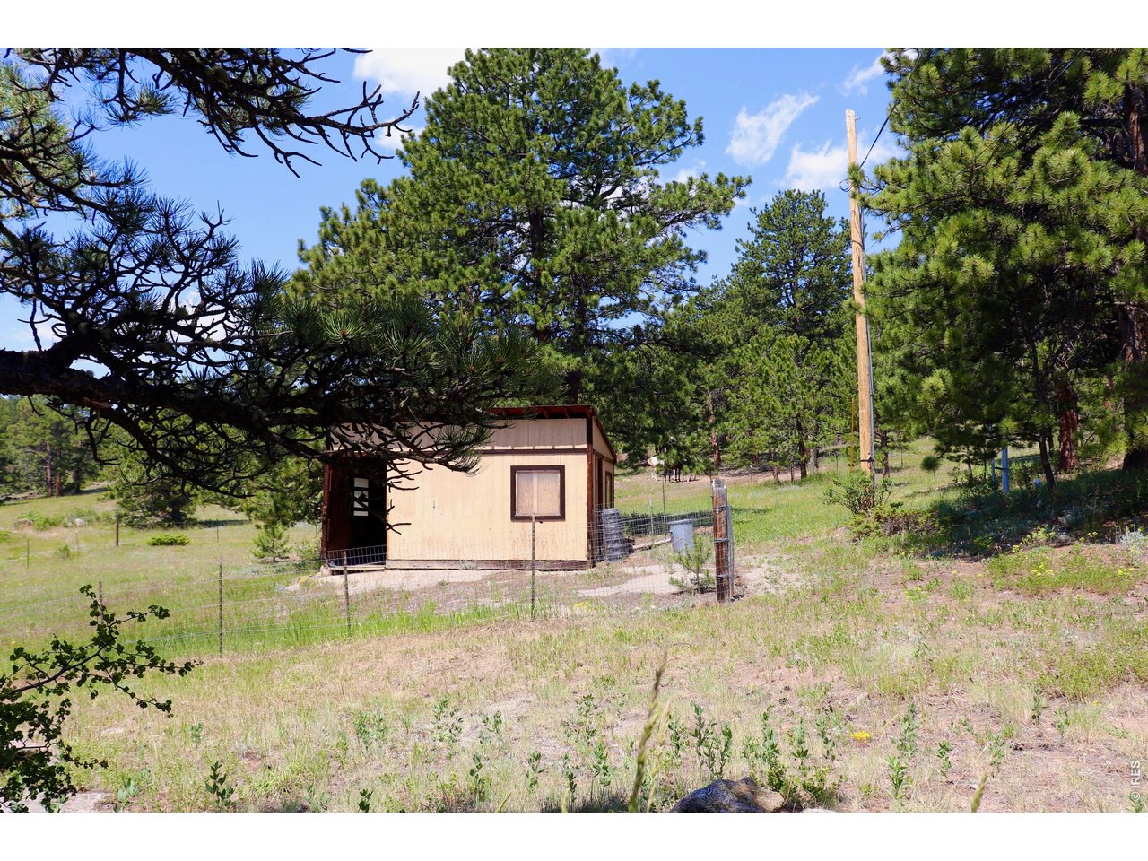 636 Ranch Road Ward, CO 80481 - Photo 18 of 24 Conveniently located just below the house, a functional horse shed is ready to welcome your equine companions or provide excellent extra storage.