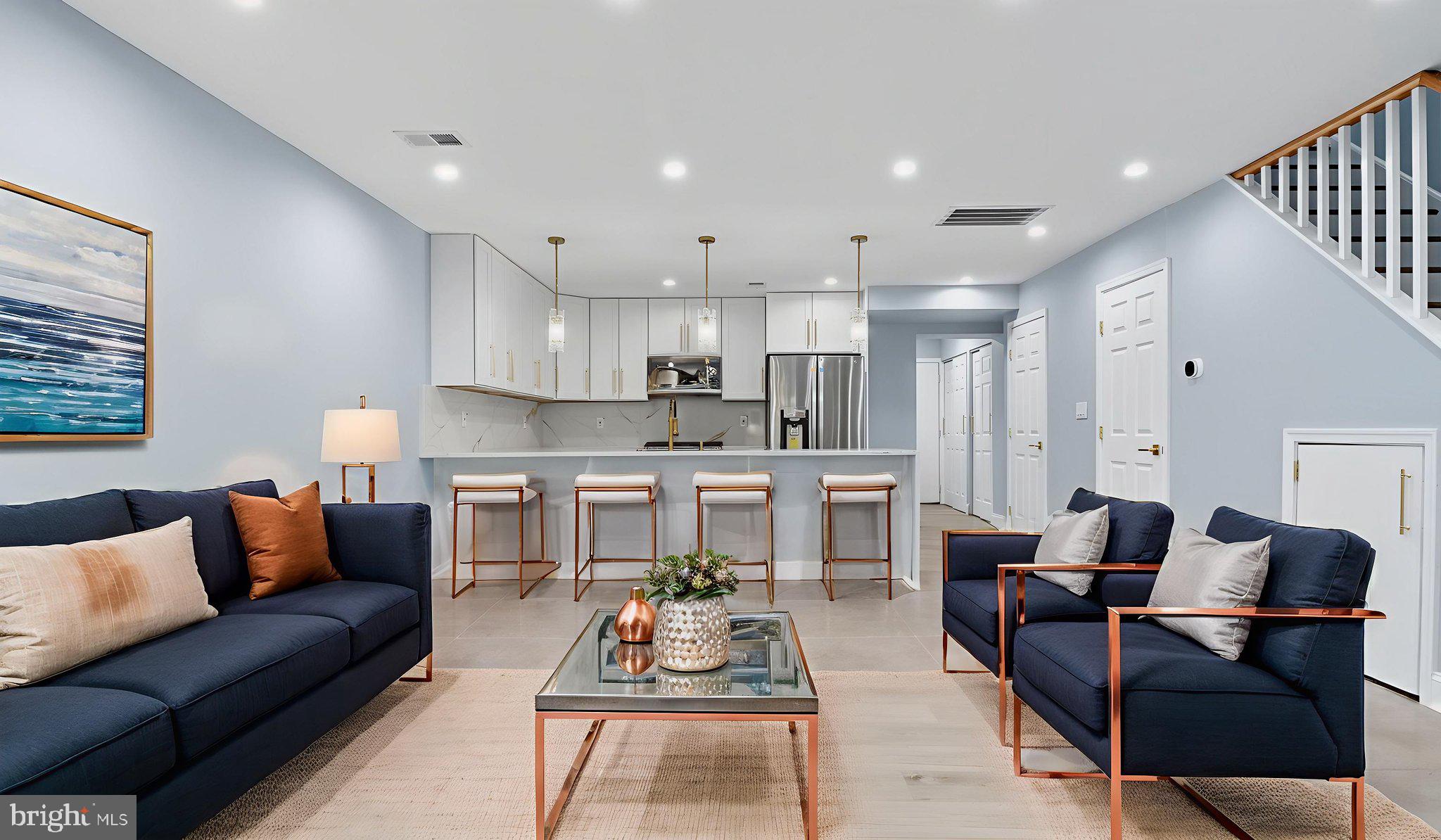 2238 15th Street Northeast Washington, DC 20018 - Photo 1 of 38 a living room with furniture and kitchen view