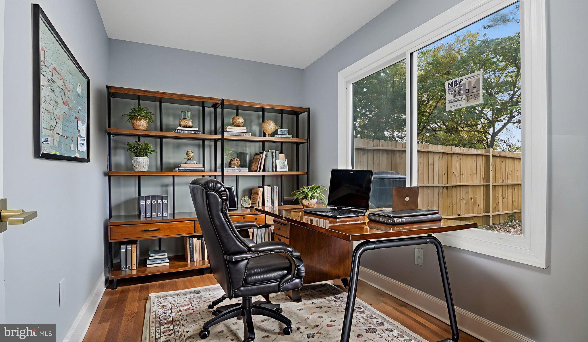 2238 15th Street Northeast Washington, DC 20018 - Photo 2 of 38 a work room with furniture and a floor to ceiling window