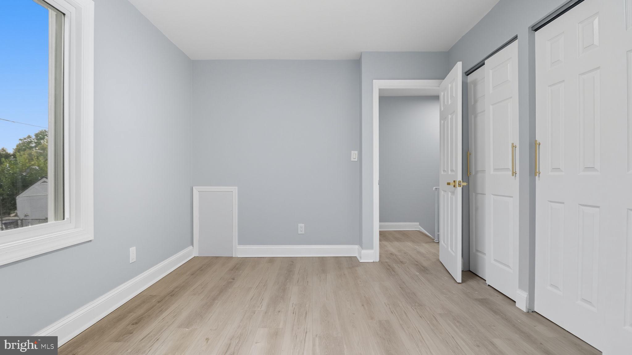 2238 15th Street Northeast Washington, DC 20018 - Photo 21 of 38 a view of hallway with a large window and wooden floor