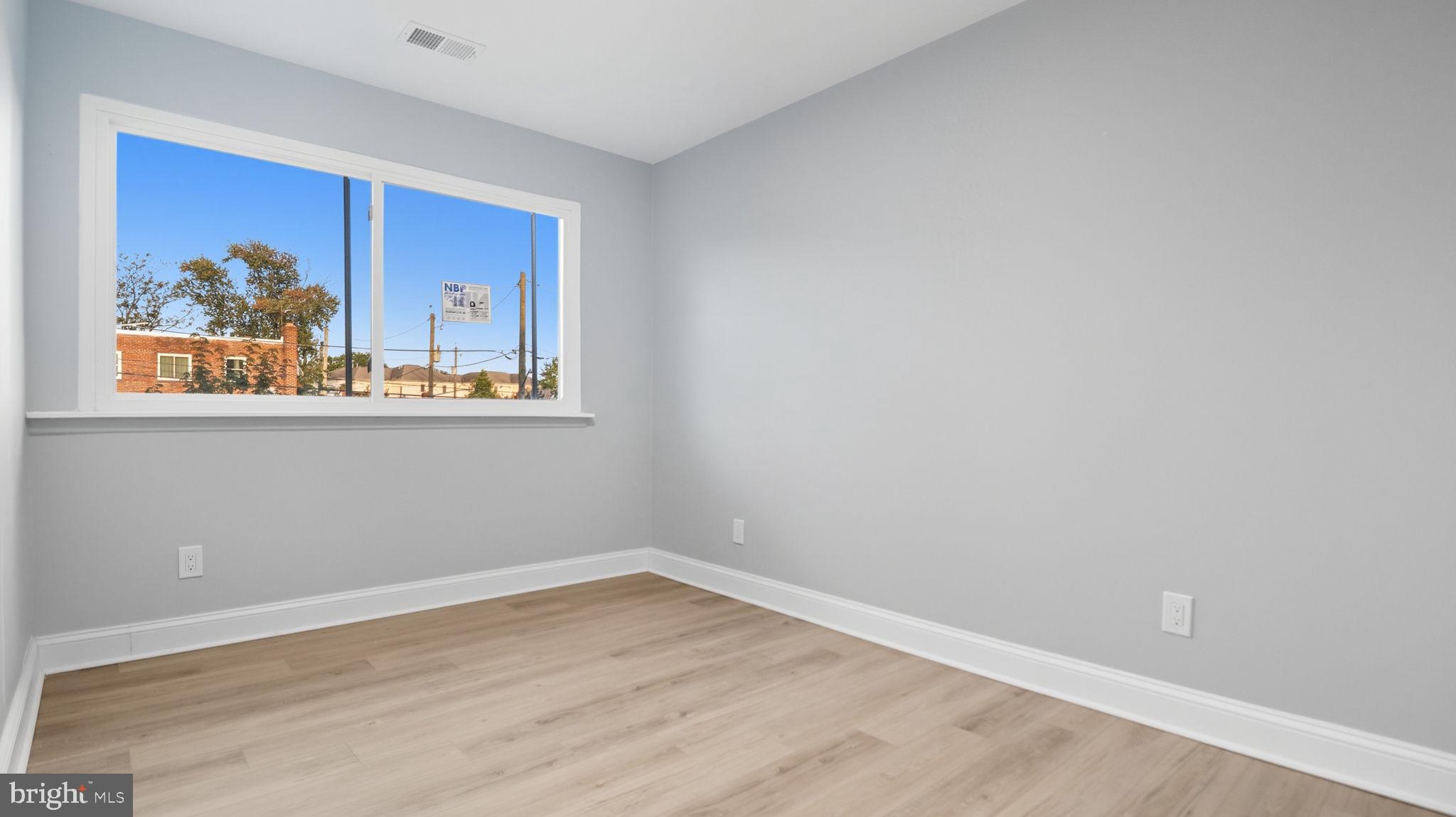 2238 15th Street Northeast Washington, DC 20018 - Photo 25 of 38 a view of a room with wooden floor and window