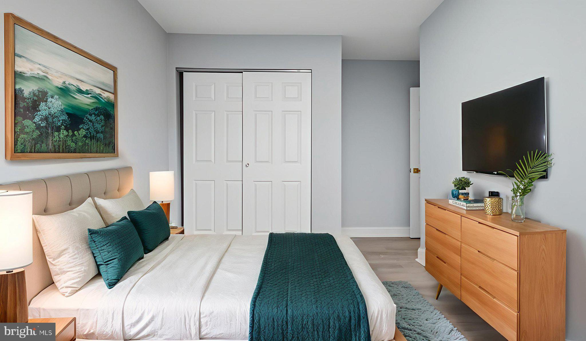2238 15th Street Northeast Washington, DC 20018 - Photo 29 of 38 a bedroom with a bed and a flat screen tv