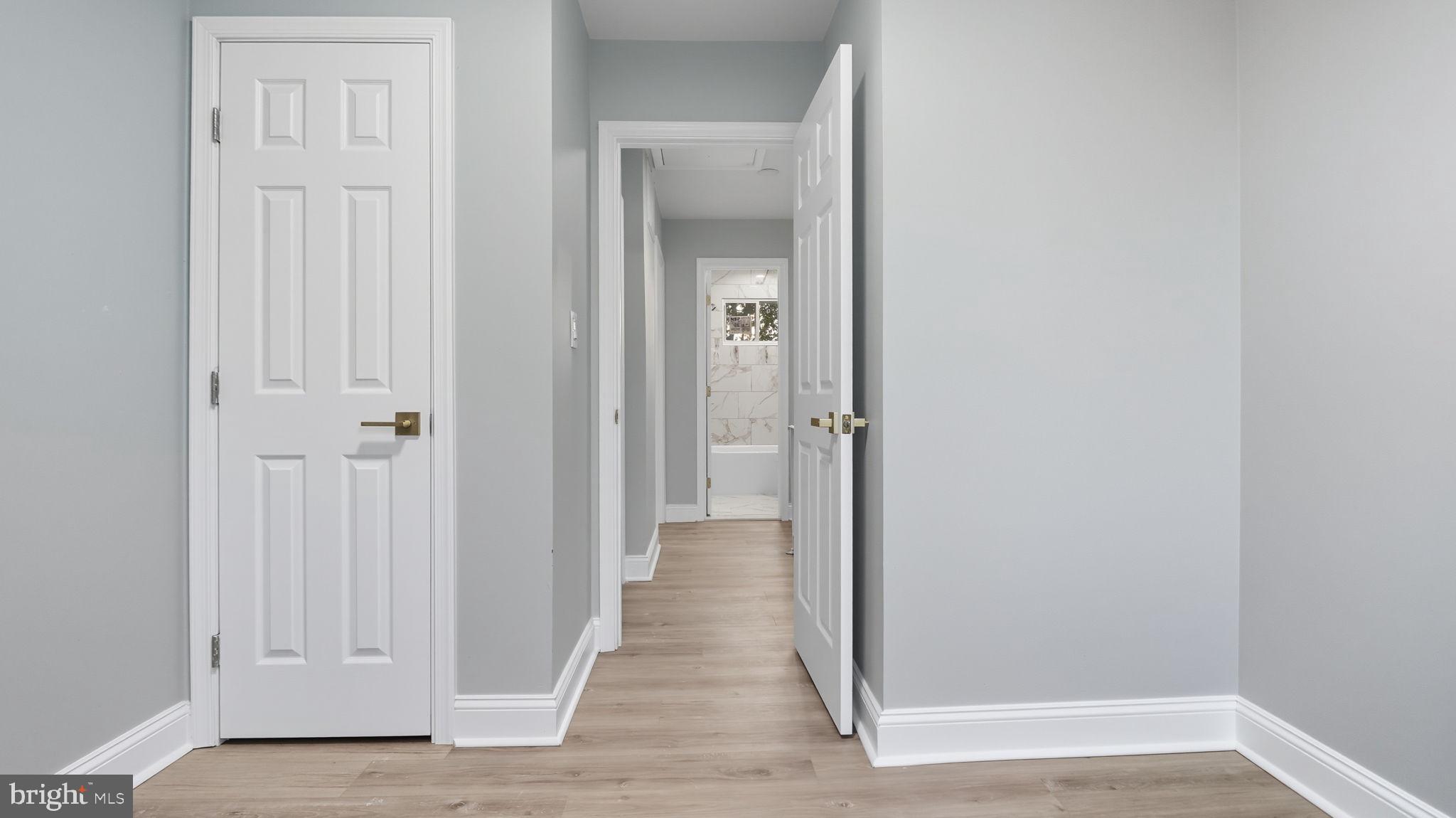 2238 15th Street Northeast Washington, DC 20018 - Photo 32 of 38 a view of a hallway with wooden floor