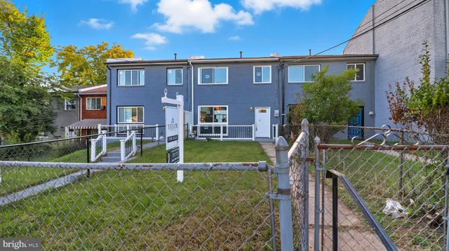 a view of house with a swimming pool