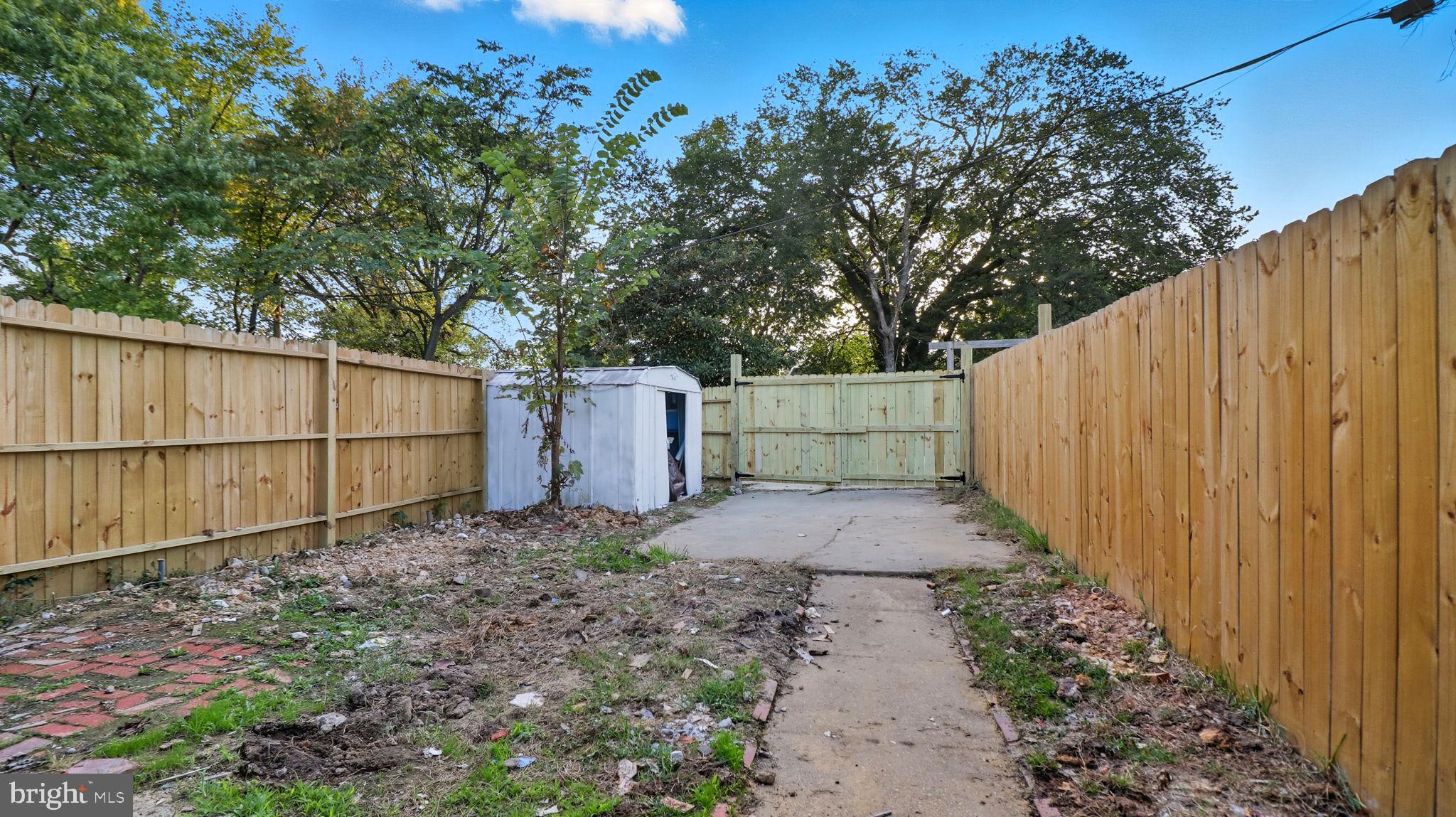 2238 15th Street Northeast Washington, DC 20018 - Photo 35 of 38 a backyard of a house with lots of green space