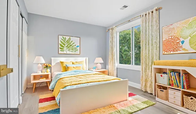a bedroom with a bed and a book shelf