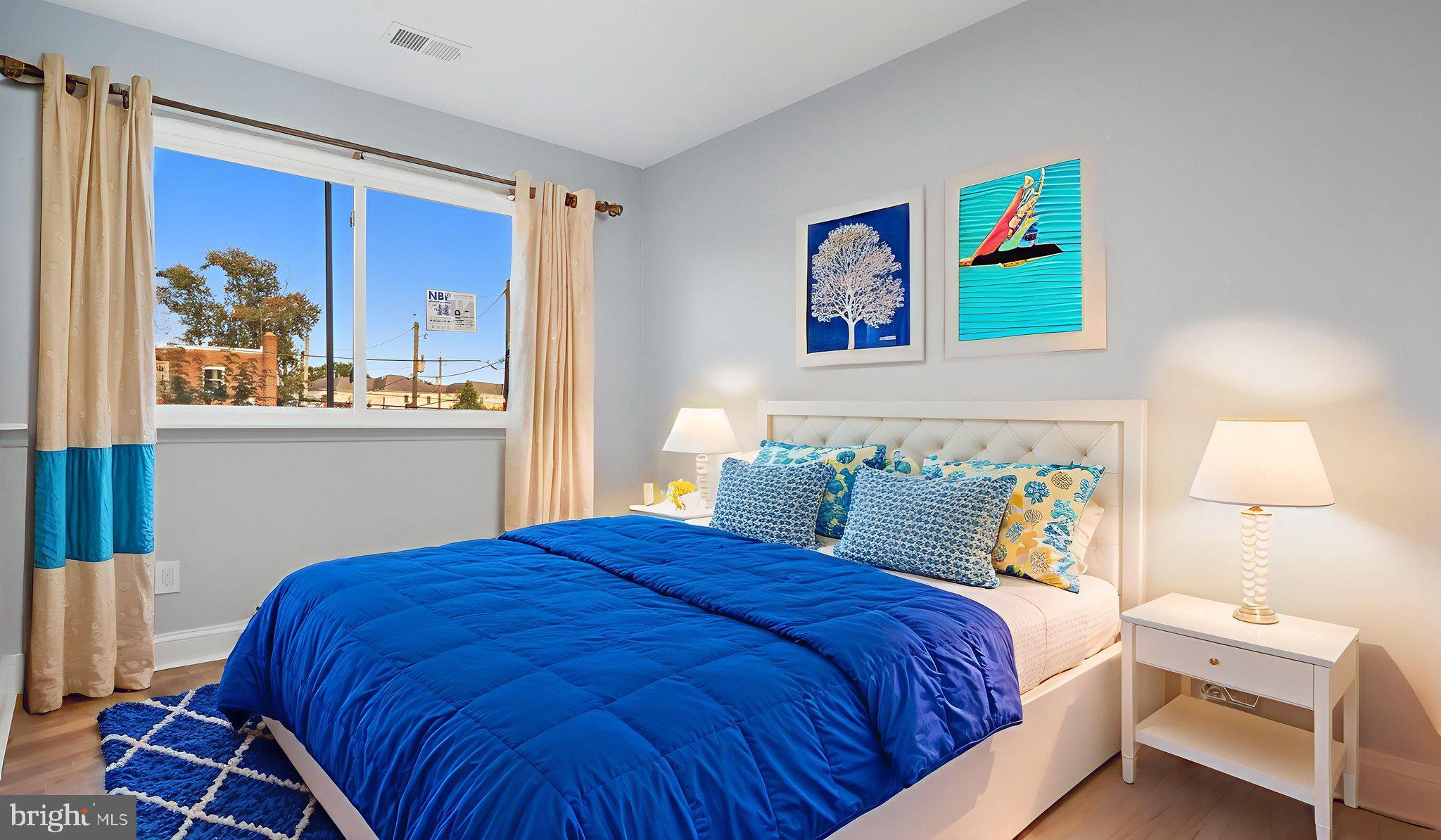 2238 15th Street Northeast Washington, DC 20018 - Photo 5 of 38 a bedroom with a bed and painting on the wall