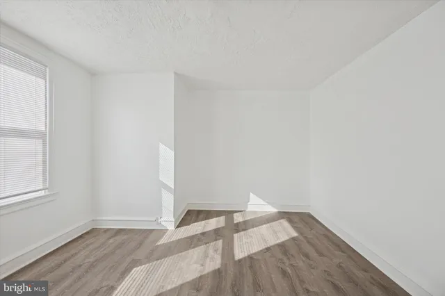 a view of wooden floor in an empty room