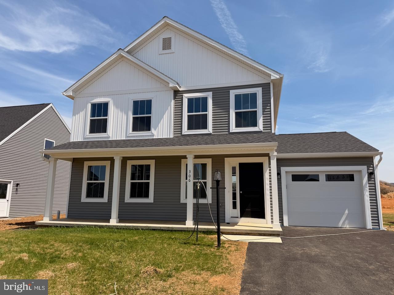 306 Rine Drive Shippensburg, PA 17257 - Photo 1 of 18 a front view of a house with a yard