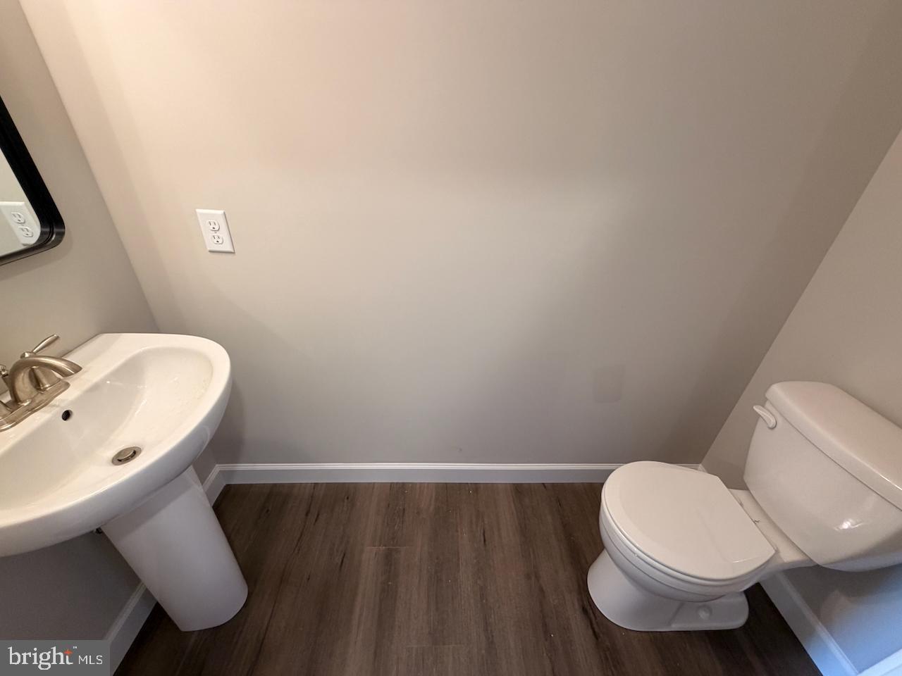 306 Rine Drive Shippensburg, PA 17257 - Photo 11 of 18 a white toilet sitting next to a bathroom sink