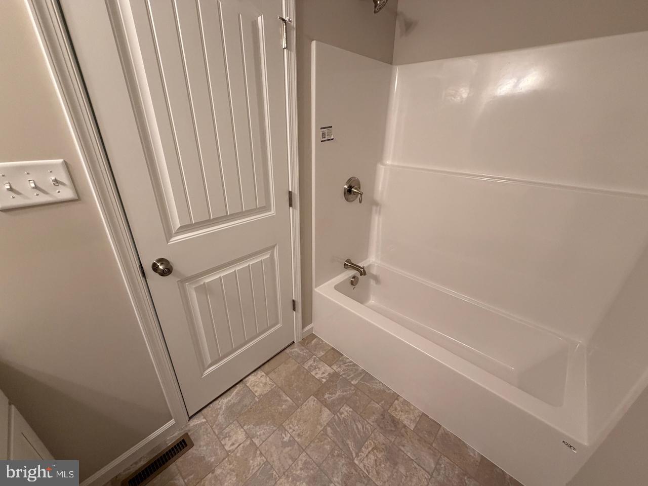 306 Rine Drive Shippensburg, PA 17257 - Photo 12 of 18 a bathroom with a tub and shower